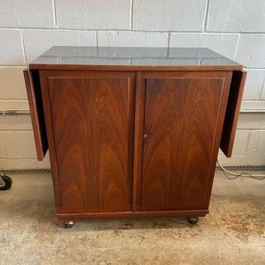 Mid Century Mod rosewood drop leaf portable bar cabinet. 