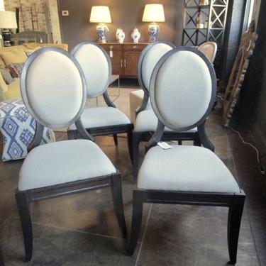 SET OF FOUR OVAL BACK DINING CHAIRS WITH BLACK FINISH