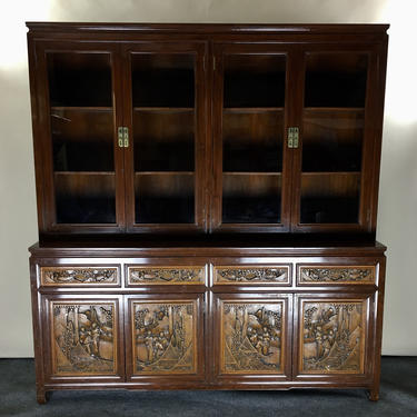 Asian china hutch with high relief carved panels 