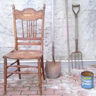 Walnut Chair staged with vintage garden tools