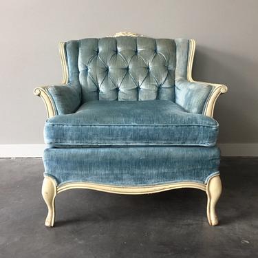 vintage tufted plush blue velvet chair.