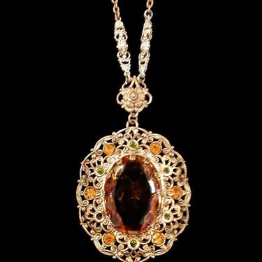 Close up detail of 1920s amber glass pendant.  #1920s #1920sjewelry #vintagenecklace #pollysuesvintageshop