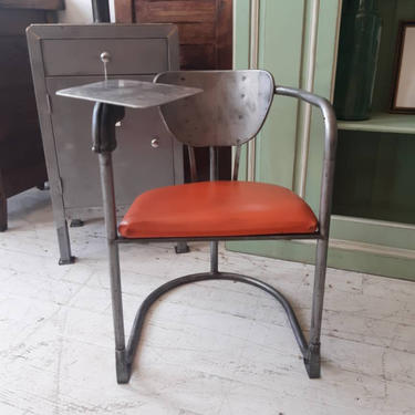 Vintage industrial midcentry stripped tubular steel chair with writing ledge 