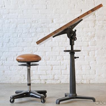 one-of-a-kind sitting or standing desk with cast iron base and custom-made upcycled top 