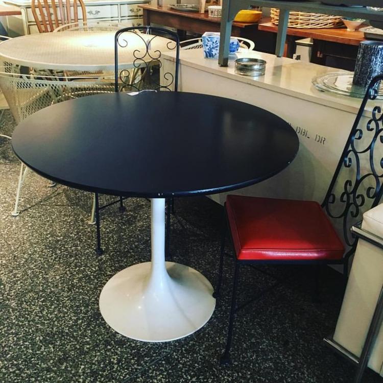 Tulip table! 3 feet in diameter, $250.  Black metal &amp; red vinyl chairs $40 each.