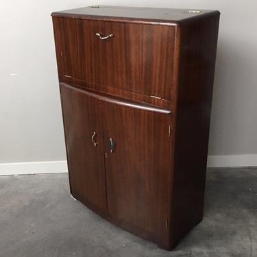 vintage mid century modern fold out bar cabinet.