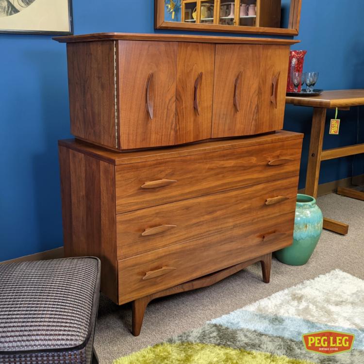 Walnut chest-on-chest dresser with bi-fold doors and sculpted pulls