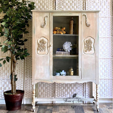 Old world finish cream elegant china cabinet. Cream antique hutch. linen cabinet. entryway cabinet. White antique bookcase 