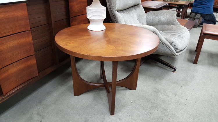 Walnut round side table from the Brasilia collection by Broyhill