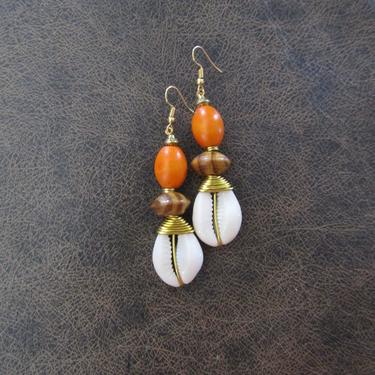 Cowrie shell earrings, long wooden earrings, African Afrocentric earrings, seashell earrings, exotic ethnic earrings, orange earrings 