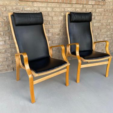Pair of Danish Mid Century Modern High Back Bentwood Arm Chairs with Black Leatherette Upholstery and Head Rests 