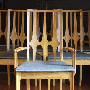Six Broyhill Brasilia walnut "cathederal" dining chairs w/new upholstery (two captains, six armless) 