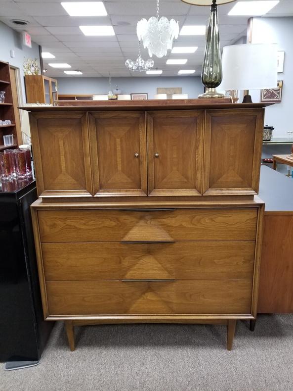 Mid-Century Modern walnut chest on chest with sculptural front