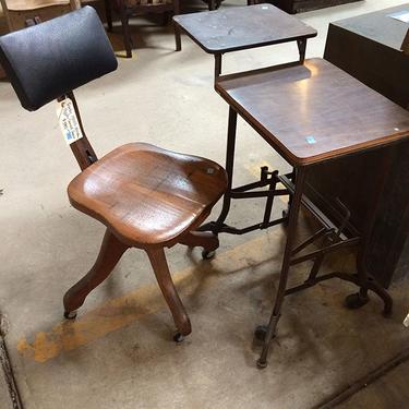 It's the whole deal. Typing table and swivel office chair from the early 1900's.