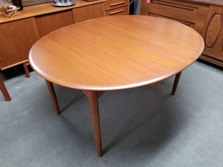Danish Modern oval teak dining table with two large leaves by Poul Dinesen