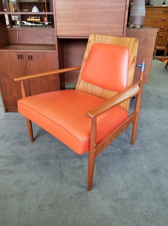 Mid-Century Modern walnut frame armchair with stell accents