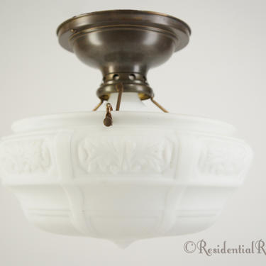 Brass ceiling fixture with embossed satin glass shade, circa 1910s