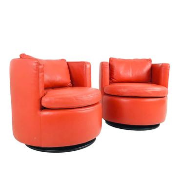 #6052 Pair of Orange Leather Swivel Chairs