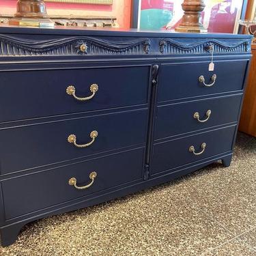Navy painted dresser, gold rope pulls and carved details. 59” x 20.5” x 34.5”