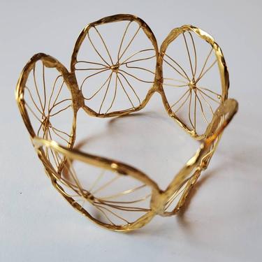 Gold spoke wheel wired modernist  bracelet 