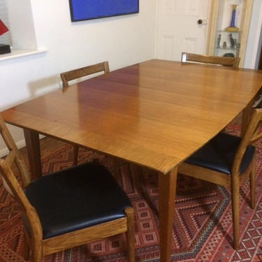 Vintage mid century modern Danish dining table and chairs. 
