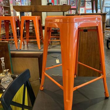 Orange metal stools. 4 available Top is 12” squared, 24” tall