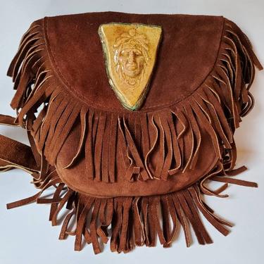 Vintage brown suede fringe crossbody bag with custom ceramic Native American emblem by Amanda Alarcon-Hunter for Minx and Onyx Vintage 
