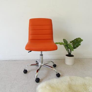 “Lucy” Orange Armless Office Chair