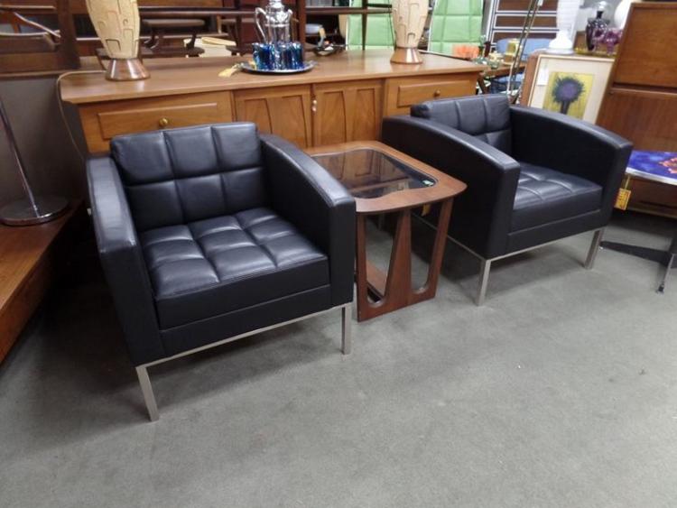 Pair of highend black leather and chrome arm chairs by Keilhaurer