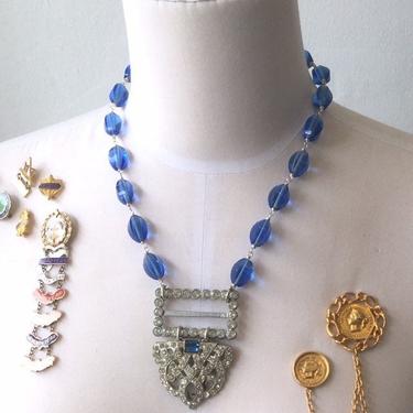Speakeasy Secrets [assemblage necklace: vintage rhinestone buckle, rhinestone dress clip, antique glass beads] 