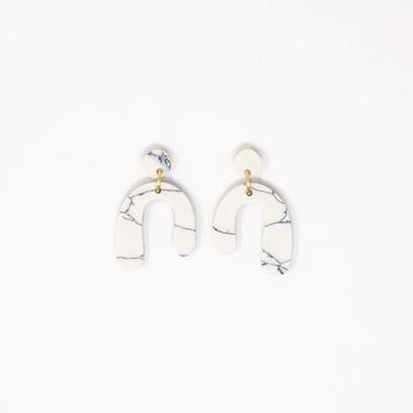 White Baby Parabola Earrings by Rover & Kin