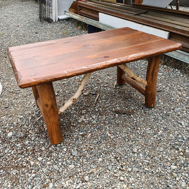 Rustic wood coffee table on casters 47 1/2
