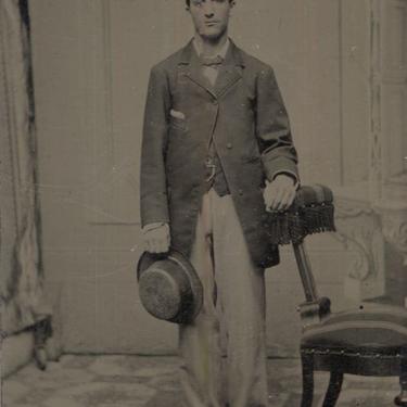 Tintype Photograph of a Standing Man with a Hat in His Hand 