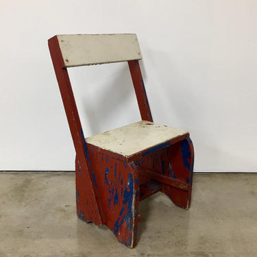 Vintage red, blue, and white child’s chair 