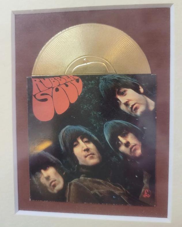 Rubber Sole. ( w leather uppers. Just got it, ha!) One of 12 top selling Beatle album mini copies in a single frame.