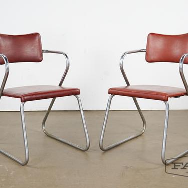 Pair of red leather chairs w/ metal frames