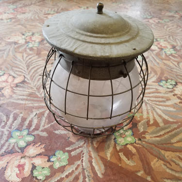 Antique gaslight globe with tin cap and cage