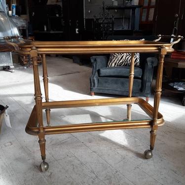 Antique gold gilt bar cart with brass handles and glass shelves 