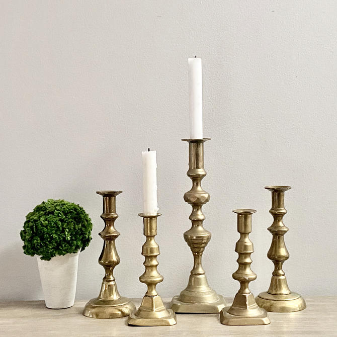 Set of Four Brass Candlestick Holders in Graduated Sizes