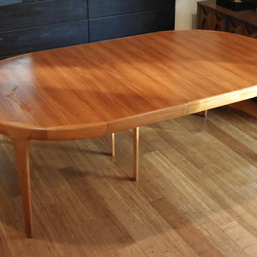 Restored Danish teak round-to-oval expandable dining table by Kofod Larsen - 87&amp;quot; long 