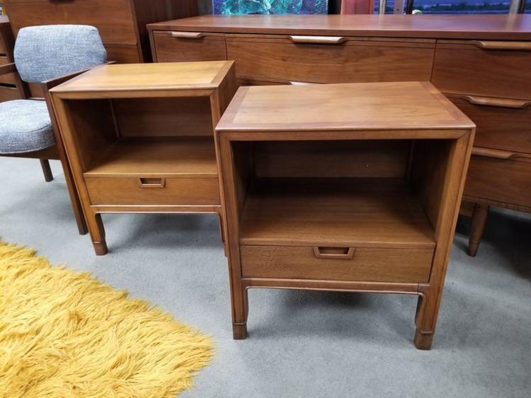                   Pair of Mid-Century Modern walnut nightstands with lower drawer