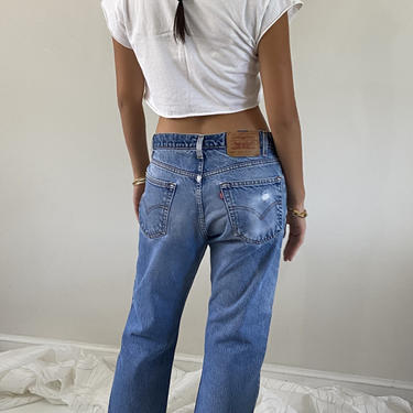 80s Levis jeans / vintage Levis 505 light wash faded destroyed denim jeans / Levis red tab relaxed slouchy fit high waisted jeans | 32 W 