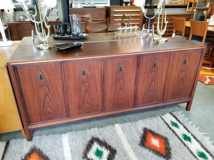 Mid-Century Modern walnut credenza with interior shelves and drawers by John Stuart