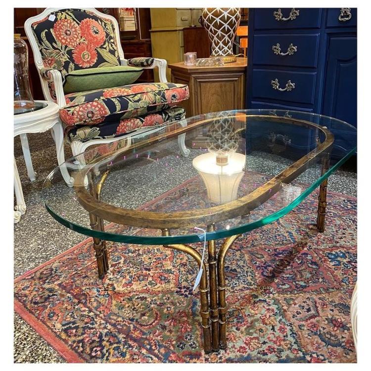Oval Glass top / Faux Bamboo base Coffee table 46” long / 28” wide / 16” height 