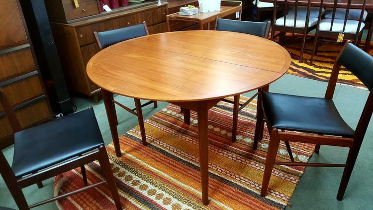 Danish Modern round teak dining table with butterfly extension by N&R Mobler