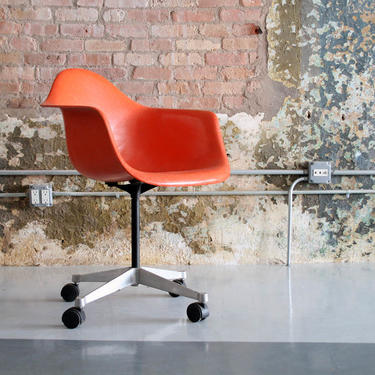 Eames Orange Swivel chair on wheeels