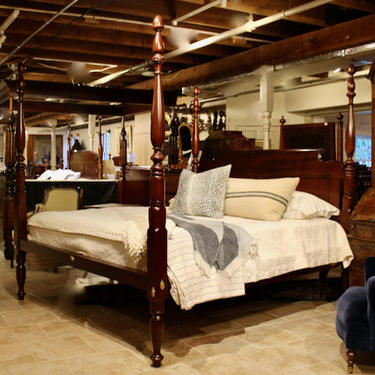 Reproduction Sheraton Tall Post bed in mahogany. King size w/ chamfered roll-back, 2 panel headboard