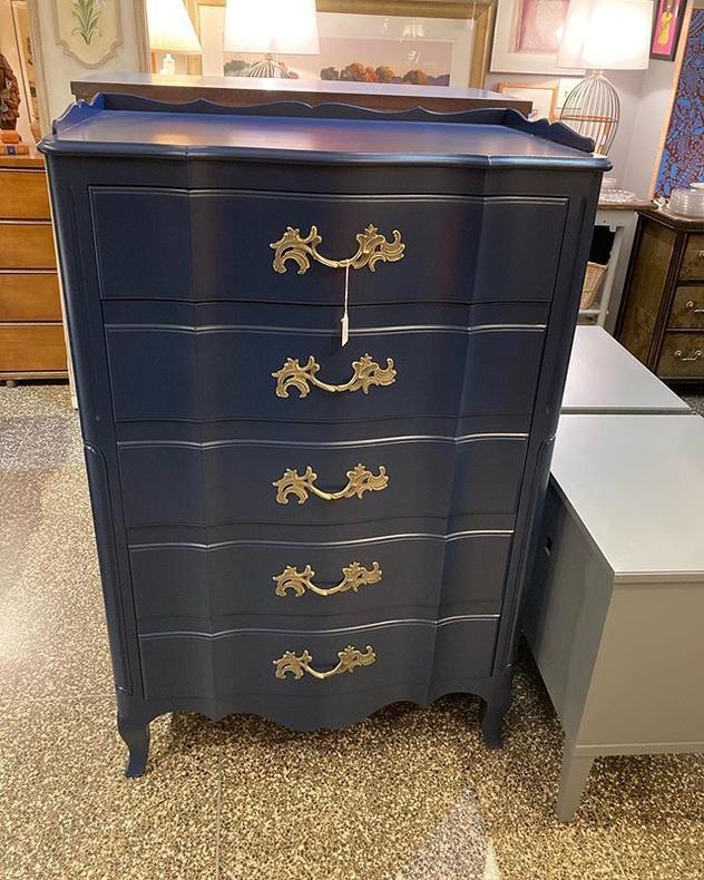 Navy blue chest of drawers manufactured by the Widdicomb company in Grand Rapids Michigan. 3”x20” x 50” 