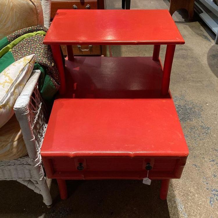 Red painted faux bamboo step end table with drawer. 2 available. 22” x 29” x 27” 