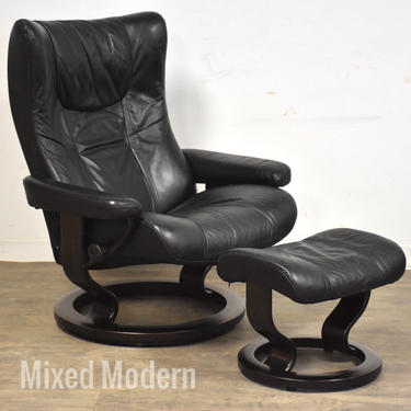 Black Leather and Ebonized Ekornes Recliner Chair and Ottoman 